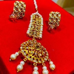 A pair of Gold Tone White Pearl Earrings with Maang Tikka for Wedding